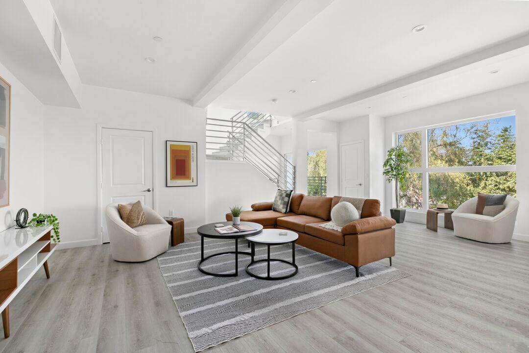 Living room with a gray rug and furniture