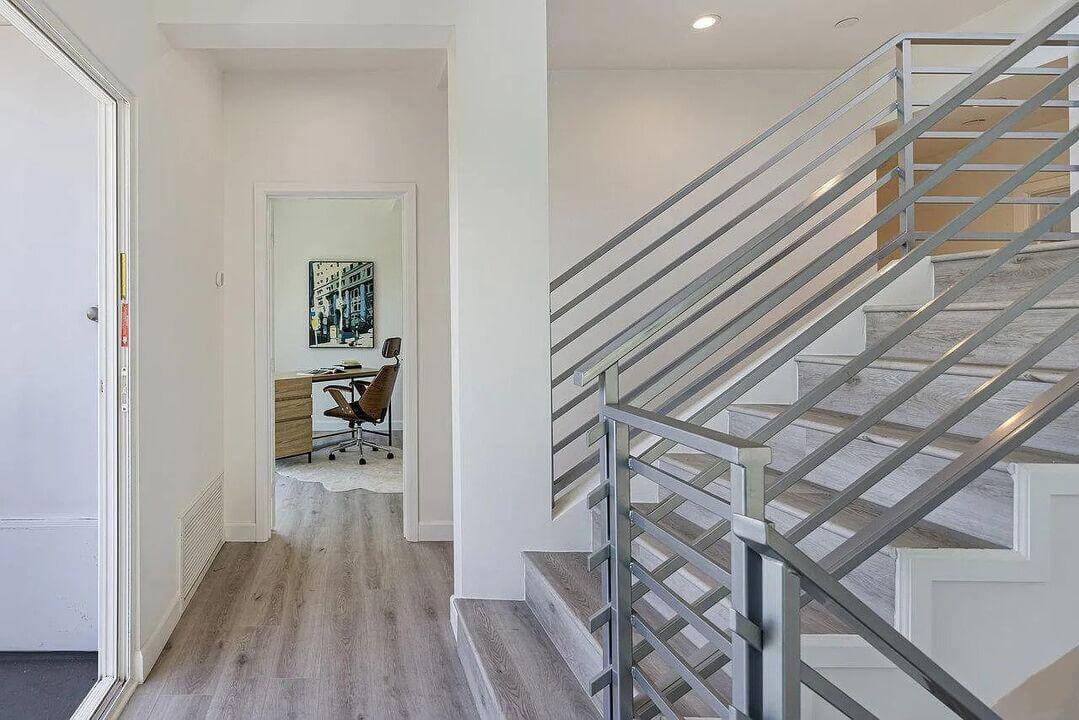 Hallway with bedrooms and a staircase